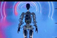This video screen grab made from Tesla AI Day 2022 livestream shows the humanoid robot walking on stage in Palo Alto, California on September 30, 2022. (Photo by various sources / AFP) / RESTRICTED TO EDITORIAL USE - MANDATORY CREDIT "AFP PHOTO / HANDOUT / TESLA " - NO MARKETING - NO ADVERTISING CAMPAIGNS - DISTRIBUTED AS A SERVICE TO CLIENTS