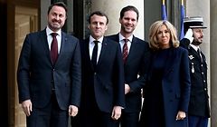 French President Emmanuel Macron (2nd-L) and his wife Brigitte (R) welcome Prime Minister of Luxembourg Xavier Bettel (L) and his husband Gauthier Destenay at the Elysee palace in Paris on January 10, 2020. (Photo by Philippe LOPEZ / AFP)