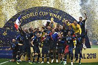 France's players hold their World Cup trophy as they celebrate their win during the trophy ceremony at the end of the Russia 2018 World Cup final football match between France and Croatia at the Luzhniki Stadium in Moscow on July 15, 2018. / AFP PHOTO / FRANCK FIFE / RESTRICTED TO EDITORIAL USE - NO MOBILE PUSH ALERTS/DOWNLOADS
