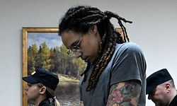 US Women's National Basketball Association (NBA) basketball player Brittney Griner, who was detained at Moscow's Sheremetyevo airport and later charged with illegal possession of cannabis, leaves the courtroom after the court's verdict in Khimki outside Moscow, on August 4, 2022. - A Russian court found Griner guilty of smuggling and storing narcotics after prosecutors requested a sentence of nine and a half years in jail for the athlete. (Photo by Kirill KUDRYAVTSEV / AFP)