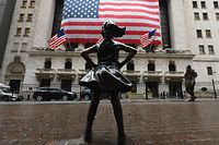 The Fearless Girl statue stands in front of the New York Stock Exchange near Wall Street on March 23, 2020 in New York City. - Wall Street fell early March 23, 2020 as Congress wrangled over a massive stimulus package while the Federal Reserve unveiled new emergency programs to boost the economy including with unlimited bond buying. About 45 minutes into trading, the Dow Jones Industrial Average was down 0.6 percent at 19,053.17, and the broad-based S&P 500 also fell 0.6 percent to 2,290.31 after regaining some ground lost just after the open. (Photo by Angela Weiss / AFP)