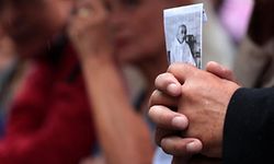 TOPSHOT - A person holds a picture of the priest Jacques Hamel outside Rouen's cathedral on August 2, 2016 during the funeral of the priest who was killed in a church in Saint-Etienne-du-Rouvray on July 26 during a hostage-taking claimed by Islamic State group.


Two jihadists, both 19, slit Hamel's throat while he was celebrating mass in an attack that shocked the country as well as the Catholic Church. The church attack came less than two weeks after another attacker ploughed a 19-tonne truck into a massive crowd celebrating Bastille Day in the Riviera city of Nice, killing 84 people and wounding more than 300 others. / AFP PHOTO / JOEL SAGET