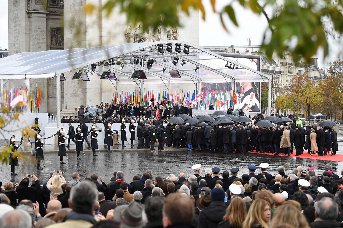 States chiefs and international organisations representatives arrive to attend a ceremony at the Arc de Triomphe in Paris on November 11, 2018 as part of commemorations marking the 100th anniversary of the 11 November 1918 armistice, ending World War I. (Photo by Eric FEFERBERG / AFP)