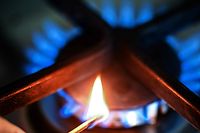 (FILES) This file photo taken on April 4, 2022 in Dortmund, western Germany, shows a flame in front of a burning hob of a gas cooker. - Consumer prices in Germany rose at their fastest pace in four decades, data published on April 28, 2022 showed, as Russia's invasion of Ukraine spurs energy prices to new heights. (Photo by Ina FASSBENDER / AFP)
