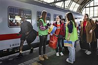 Ukrainian refugees are helped by volunteers upon their arrival at Amsterdam Central station by train from Berlin, on March 28, 2022, amir Russian invasion of Ukraine. (Photo by Ramon van Flymen / ANP / AFP) / Netherlands OUT