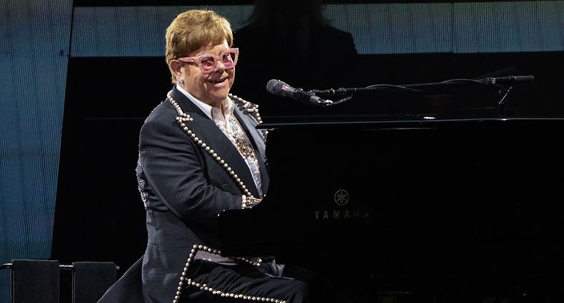 (FILES) In this file photo taken on October 29, 2022 British musician Elton John performs onstage during the "Farewell Yellow Brick Road The Final Tour" at the Alamodome in San Antonio, Texas. - Elton John will bring the curtain down on his final UK tour with a debut performance at Glastonbury next June, organisers of the legendary music festival said on December 2, 2022. (Photo by SUZANNE CORDEIRO / AFP)