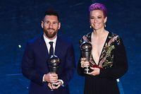 TOPSHOT - Best FIFA Men's Player of 2019, Argentina and Barcelona forward Lionel Messi (L) and Best FIFA Women's Player of 2019, US and Reign FC midfielder Megan Rapinoe pose at the end of The Best FIFA Football Awards ceremony, on September 23, 2019 in Milan. (Photo by Marco Bertorello / AFP)