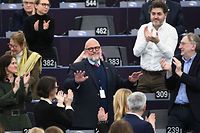 Luxembourg's Marc Angel (C) is congratulated after being elected Vice-President of European Parliament, at the European Parliament in Strasbourg, eastern France on January 18, 2023. (Photo by FREDERICK FLORIN / AFP)