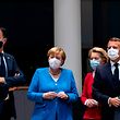 TOPSHOT - Netherlands' Prime Minister Mark Rutte (L) looks on next to Germany's Chancellor Angela Merkel ( 2nd L), President of the European Commission Ursula von der Leyen (2nd R) and France's President Emmanuel Macron prior the start of the European Council building in Brussels, on July 18, 2020, as the leaders of the European Union hold their first face-to-face summit over a post-virus economic rescue plan. - The EU has been plunged into a historic economic crunch by the coronavirus crisis, and EU officials have drawn up plans for a huge stimulus package to lead their countries out of lockdown. (Photo by Francisco Seco / POOL / AFP)