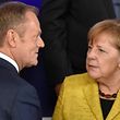 European council President Donald Tusk (2ndL) talks with German Chancellor Angela Merkel (2nd-R) and Dutch Prime minister Mark Rutte (1st-R)  next to French President of Republic Emmanuel Macron (1st-L) during the family photo after the Reinforcing European Defence meeting on first day of a European union summit in Brussels at the EU headquarters on December 14, 2017.
European leaders will discuss the migration crisis and defence on December 14, followed by Brexit the day after. / AFP PHOTO / JOHN THYS