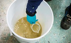 Hanna Gottas from Stockholm Vatten och Avfall (SVOA), puts a sample of wastewater into a small container after samples collected from different areas of the capital arrived at the Bromma wastewater treatment plant, on October 21, 2020 in Bromma, near Stockholm. - Researchers have been testing wastewater from three facilities in Stockholm since mid-April after studies showed that remnants of the novel coronavirus could be detected in sewage water. The sewage water testing could help provide important insights into the spread and prevalence of the disease without the need for expensive widespread individual tests. (Photo by Jonathan NACKSTRAND / AFP)