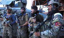 Afghan security force personnel stand guard along the roadside in Herat on August 12, 2021, as Taliban took over the police headquarters in Herat, Afghanistan's third-largest city and also seized another key district capital just 150 kilometres (95 miles) from capital Kabul. (Photo by - / AFP)