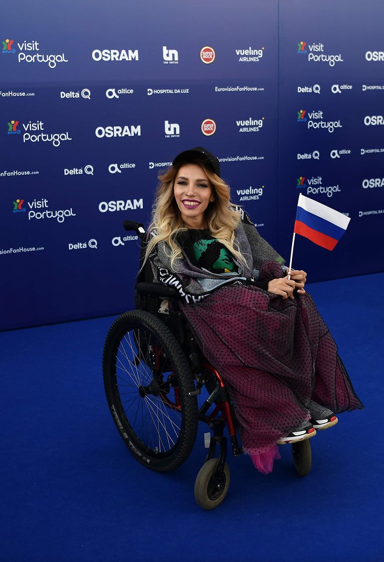 CORRECTION - Russian singer Yuliya Samoilova poses for pictures during the Red Carpet ceremony of the 63rd edition of the Eurovision Song Contest 2018 at the Altice Arena in Lisbon, on May 6, 2018.  
The Eurovision Song Contest 2018 will be held in the Portuguese capital Lisbon from May 8 until May 12, 2018. / AFP PHOTO / Francisco LEONG / �The erroneous mention[s] appearing in the metadata of this photo by Francisco LEONG has been modified in AFP systems in the following manner: [Yuliya Samoilova ] instead of [Julia Samoylova]. Please immediately remove the erroneous mention[s] from all your online services and delete it (them) from your servers. If you have been authorized by AFP to distribute it (them) to third parties, please ensure that the same actions are carried out by them. Failure to promptly comply with these instructions will entail liability on your part for any continued or post notification usage. Therefore we thank you very much for all your attention and prompt action. We are sorry for the inconvenience this notification may cause and remain at your disposal for any further information you may require.�