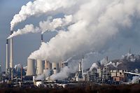Steam and smoke is seen over the coal burning power plant in Gelsenkirchen, Germany, on Wednesday, Dec. 16, 2009. Coal power plants are among the biggest producer of CO2, that is believed to be responsible for climate change. Delegates from 193 nations at a U.N. climate talks conference in Copenhagen are deadlocked in talks on a deal to curb global warming. (AP Photo/Martin Meissner)