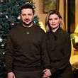 A handout photo taken and released by the Ukrainian President's Office on December 31, 2022 shows President Volodymyr Zelensky and his wife Olena greeting the Ukrainian people for the New Year.  (Photo by AFP)