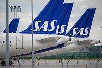 Scandinavian airline SAS aircraft of the type Airbus A321 and A320 Neo are parked at Kastrup airport on July 4, 202 after the 900 pilots at SAS went on strike. - Scandinavian airline SAS said that negotiations between the carrier and the pilots' union had failed to reach an agreement, prompting some 900 pilots to strike. (Photo by Johan NILSSON / TT News Agency / AFP) / Denmark OUT