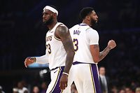 (FILES) In this file photo taken on October 16, 2019 LeBron James (L) and Anthony Davis (R) of the Los Angeles Lakers look on during the second half of a game against the Golden State Warriors at Staples Center in Los Angeles. - The first chapter in the most compelling storyline of the new NBA season will be written on October 22, as LeBron James and the Los Angeles Lakers face off against Kawhi Leonard and the Los Angeles Clippers. (Photo by Sean M. Haffey / GETTY IMAGES NORTH AMERICA / AFP)