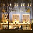 A  police office is silhouetted against the brightly lit main entrance of the Waldorf Astoria Hotel in New York, Thursday, Jan. 31, 2002 where the World Economic Forum is being held. Some 4,000 police were assigned to forum security, with many concentrated around the conference site. (AP Photo/Ron Frehm)