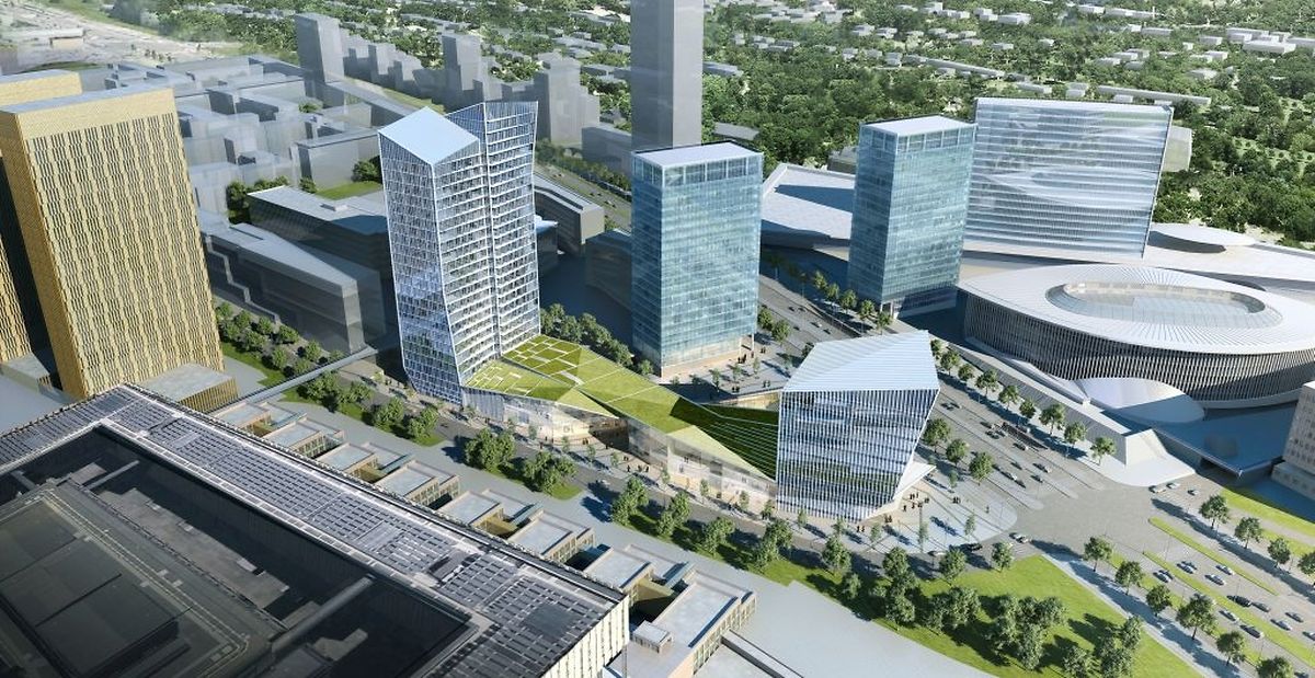 Au centre, la tour B des Portes de l'Europe. A gauche, la tour de 21 étages. En bas, le centre commercial avec son toit végétalisé et à droite, la tour plus petite où seront installés des bureaux.