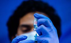 (FILES) In this file photo medical worker Robert Gilbertson loads a syringe with the Moderna Covid-19 vaccine to be administered by nurses at a vaccination site at Kedren Community Health Center, in South Central Los Angeles, California on February 16, 2021. - The United States will hit President Joe Biden's target of administering 200 million doses of coronavirus vaccines within his first 100 days in office by the end of this week, the White House said on April 21, 2021. Biden will make a speech later in which he will "note that the United States will reach over 200 million shots this week," a White House official said on condition of anonymity. (Photo by Apu GOMES / AFP)