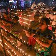 TOPSHOT - Hindu devotees light oil lamps during Lakshadeepotsava, the festival of a hundred thousand lamps, during the Shivarathri festival at the Basavanna Temple on the outskirts of Bangalore on March 1, 2022. (Photo by Manjunath Kiran / AFP)