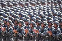 (FILES) This file photo taken on July 30, 2017 shows Chinese soldiers applauding during a military parade at the Zhurihe training base in China's northern Inner Mongolia region. - China will increase its military budget by 6.6 percent in 2020, the government announced on May 22, 2020 at the opening session of its annual National People's Congress in Beijing. (Photo by STR / AFP) / China OUT