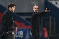 Manchester City's Spanish manager Pep Guardiola gives his instructions (R) next to Paris Saint-Germain's Argentinian head coach Mauricio Pochettino during the UEFA Champions League first leg semi-final football match between Paris Saint-Germain (PSG) and Manchester City at the Parc des Princes stadium in Paris on April 28, 2021. (Photo by Anne-Christine POUJOULAT / AFP)