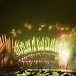 TOPSHOT - New Year's Eve fireworks erupt over Sydney's iconic Harbour Bridge and Opera House (L) during the fireworks show on January 1, 2021. (Photo by SAEED KHAN / AFP)