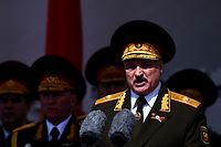 (FILES) In this file photo taken on May 09, 2020 Belarus' President Alexander Lukashenko gives a speech during a military parade to mark the 75th anniversary of the Soviet Union's victory over Nazi Germany in World War Two, Minsk. - Belarusian President Alexander Lukashenko on September 8, 2020 suggested that Russia would be next if his regime falls in the face of a wave of mass demonstrations. "You know what we concluded with the Russian establishment and leadership? If Belarus falls, Russia will be next," state news agency RIA Novosti quoted Lukashenko as saying in an interview with several Russian media. (Photo by Sergei GAPON / POOL / AFP)