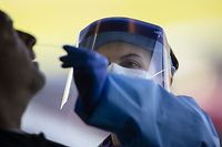 SPRINGFIELD, TN - APRIL 18: Detail view of a medical professional administering a test for coronavirus (covid-19) at a drive thru test site on April 18, 2020 in Springfield, Tennessee. Tennessee drive thru testing sites now allow those without symptoms of coronavirus (covid-19) to receive testing.   Brett Carlsen/Getty Images/AFP
== FOR NEWSPAPERS, INTERNET, TELCOS & TELEVISION USE ONLY ==