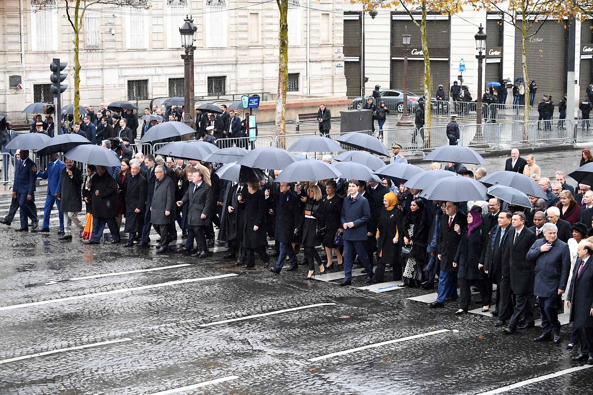 States chiefs and international organisations representatives arrive to attend a ceremony at the Arc de Triomphe in Paris on November 11, 2018 as part of commemorations marking the 100th anniversary of the 11 November 1918 armistice, ending World War I. (Photo by Eric FEFERBERG / AFP)