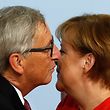 German Chancellor Angela Merkel welcomes the President of the European Commission Jean-Claude Juncker as he arrives to attend the G20 summit in Hamburg, northern Germany, on July 7, 2017.
Leaders of the world's top economies gather from July 7 to 8, 2017 in Germany for likely the stormiest G20 summit in years, with disagreements ranging from wars to climate change and global trade. / AFP PHOTO / Odd ANDERSEN