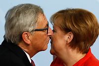 German Chancellor Angela Merkel welcomes the President of the European Commission Jean-Claude Juncker as he arrives to attend the G20 summit in Hamburg, northern Germany, on July 7, 2017.
Leaders of the world's top economies gather from July 7 to 8, 2017 in Germany for likely the stormiest G20 summit in years, with disagreements ranging from wars to climate change and global trade. / AFP PHOTO / Odd ANDERSEN