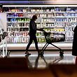 (FILES) File photo taken on April 29, 2020 shows a customer pushing a shopping cart past the shelves at a supermarket in Dusseldorf, western Germany, on April 29, 2020.  - A rise in consumer prices in the euro zone, fueled even higher by Russia's invasion of Ukraine 