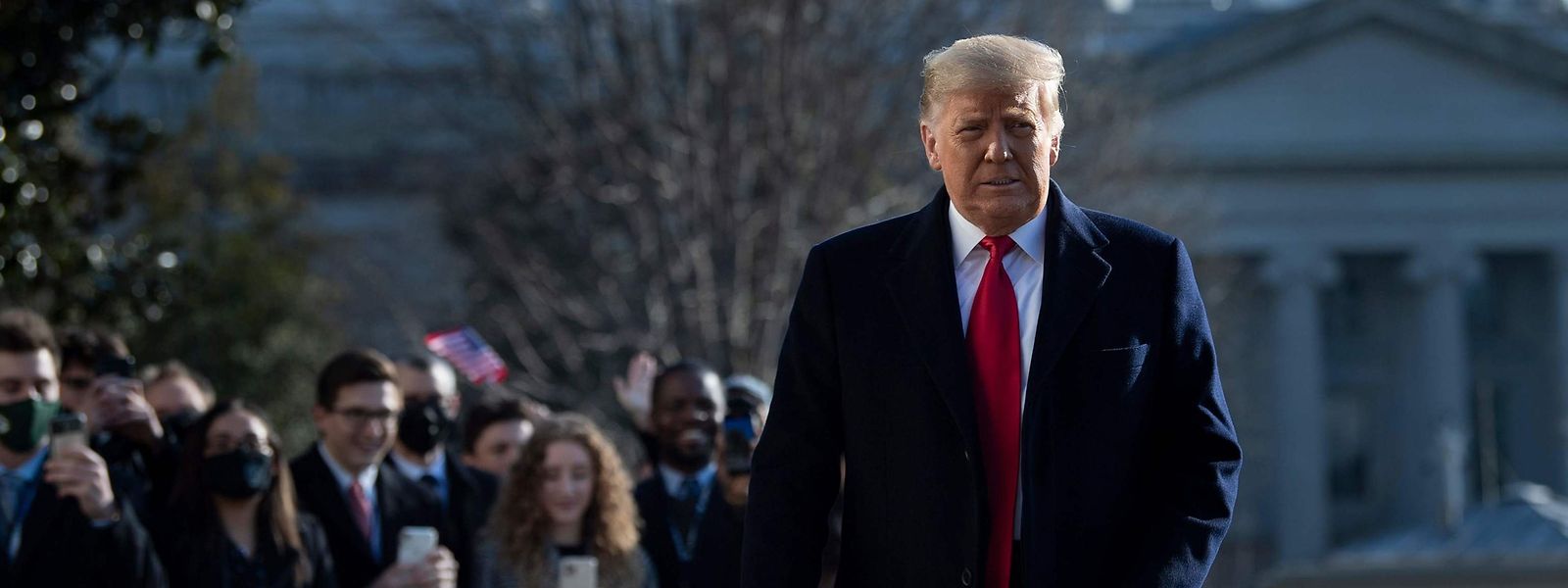 US President Donald Trump walks by supporters outside the White House on January 12, 2021 in Washington,DC before his departure to Alamo, Texas. (Photo by Brendan Smialowski / AFP)