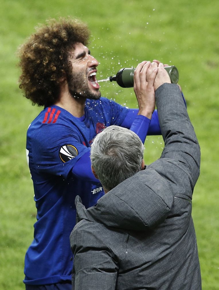 Football Soccer - Ajax Amsterdam v Manchester United - UEFA Europa League Final - Friends Arena, Solna, Stockholm, Sweden - 24/5/17 Manchester United manager Jose Mourinho helps Marouane Fellaini squeeze the water bottle Reuters / Phil Noble Livepic