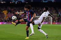 Barcelona's Spanish defender Hector Bellerin (L) fights for the ball with Bayern Munich's Canadian midfielder Alphonso Davies during the UEFA Champions League 1st round day 5, Group C football match between FC Barcelona and FC Bayern Munich at the Camp Nou stadium in Barcelona on October 26, 2022. (Photo by Josep LAGO / AFP)