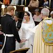 Britain's Prince Harry, Duke of Sussex, and US fiancee of Britain's Prince Harry Meghan Markle during their wedding ceremony in St George's Chapel, Windsor Castle, in Windsor, on May 19, 2018. / AFP PHOTO / POOL / Dominic Lipinski