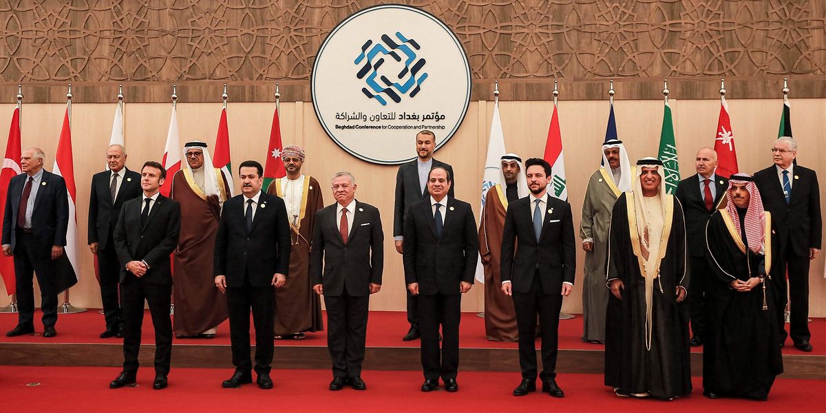 (Front L to R) French President Emmanuel Macron, Iraq's Prime Minister Mohamed Shia al-Sudani, Jordan's King Abdullah, Egypt's President Abdel Fattah al-Sisi, Jordan's Crown Prince Hussein, the ruler of the UAE's Emirate of Ras al-Khaimah Sheikh Saud bin Saqr al-Qasimi, Saudi Arabia's Foreign Minister Prince Faisal bin Farhan al-Saud; along with the High Representative of the European Union for Foreign Affairs and Security Policy Josep Borrell (Behind L), Arab League Secretary-General Ahmed Aboul-Gheit (2nd-L), Iranian Foreign Minister Hossein Amir-Abdollahian (Behind 5th-L), and other dignitaries pose together in a family photo at the start of the "Baghdad Conference for Cooperation and Partnership" in Sweimeh by the Dead Sea shore in central-west Jordan on December 20, 2022