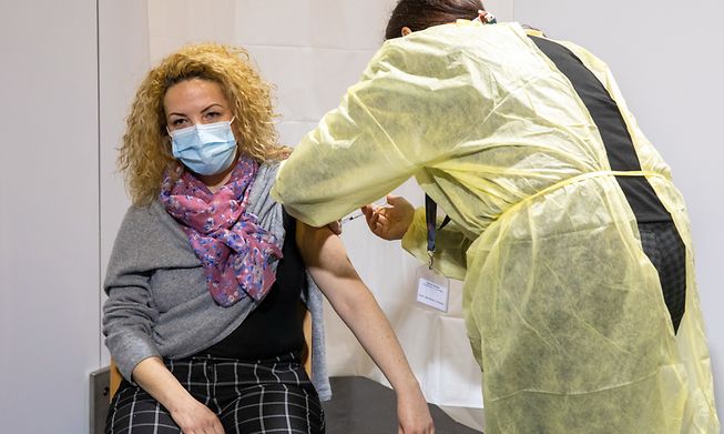 A woman receiving a Covid-19 vaccine at a centre in Luxembourg last year