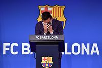 TOPSHOT - Barcelona's Argentinian forward Lionel Messi cries during a press conference at the Camp Nou stadium in Barcelona on August 8, 2021. - The six-time Ballon d'Or winner Messi had been expected to sign a new five-year deal with Barcelona on August 5 but instead, after 788 games, the club announced he is leaving at the age of 34. (Photo by Pau BARRENA / AFP)