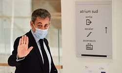 Former French President Nicolas Sarkozy waves as he leaves after a hearing at his trial on corruption charges on December 8, 2020 at Paris courthouse. - Prosecutors in the graft trial of French ex-president Nicolas Sarkozy on December 8, 2020 called for him to be sentenced to a prison term of four years, two of which should be suspended. The 65-year-old rightwinger, the country's first modern head of state to appear in the dock, is accused of trying to bribe a judge with a plum retirement job in exchange for inside information on an inquiry into his campaign finances. (Photo by Martin BUREAU / AFP)