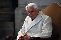 (FILES) In this file photo taken on December 08, 2015 Pope Emeritus Benedict XVI is pictured at St Peter's basilica in The Vatican before the opening of the "Holy Door" by Pope Francis to mark the start of the Jubilee Year of Mercy. - Former pope Benedict XVI failed to stop four clergymen accused of child sex abuse in the Catholic Church in Munich, the law firm that carried out a key probe said on January 20, 2022. The ex-pontiff -- who was the archbishop of Munich and Freising from 1977 to 1982 -- has "strictly" denied any responsibility, said lawyer Martin Pusch of Westpfahl Spilker Wastl which was tasked by the church to carry out the probe. (Photo by Vincenzo PINTO / AFP)