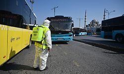 A members of Istanbul Metropolitan Municipality disinfect a public bus at Eminonu in Istanbul to prevent the spread of the novel coronavirus, COVID-19, on March 20, 2020. - The religious affairs authority, Diyanet, ordered the closure of around 90,000 mosques in Turkey on March 20, the day of particularly important prayers in the Muslim faith. (Photo by Ozan KOSE / AFP)