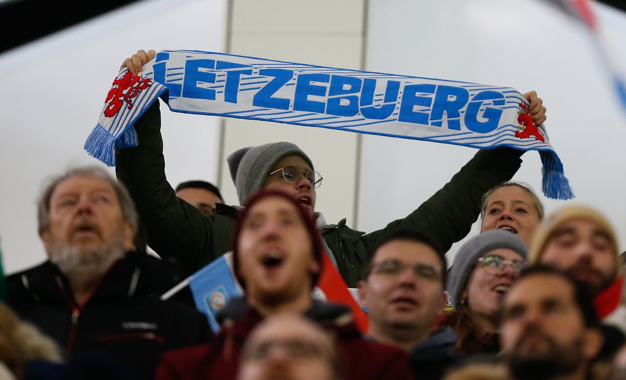 This fan with the Luxembourg scarf was able to grab one of the most sought after tickets on his team.