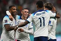 England's forward #07 Jack Grealish (R) celebrates with teammates defender #02 Kyle Walker (L), forward #20 Phil Foden (2L) and forward #11 Marcus Rashford after scoring his team's sixth goal during the Qatar 2022 World Cup Group B football match between England and Iran at the Khalifa International Stadium in Doha on November 21, 2022. (Photo by Paul ELLIS / AFP)