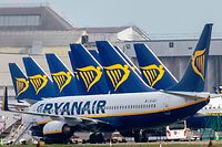 (FILES) In this file photo taken on March 23, 2020, Ryanair passenger jets are seen on the tarmac at Dublin airport. - Ryanair will cut by its September and October timetable by "20 percent" on weaker-than-expected demand following renewed travel restrictions in some European countries, the no-frills Irish airline said Monday, August 17. (Photo by Paul Faith / AFP)