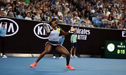 Coco Gauff of the US hits a return against Venus Williams of the US during their women's singles match on day one of the Australian Open tennis tournament in Melbourne on January 20, 2020. (Photo by Manan VATSYAYANA / AFP) / IMAGE RESTRICTED TO EDITORIAL USE - STRICTLY NO COMMERCIAL USE