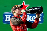 Ferrari's Monegasque driver Charles Leclerc celebrates his victory at the podium after the 2022 Formula One Australian Grand Prix at the Albert Park Circuit in Melbourne on April 10, 2022. (Photo by Con Chronis / AFP) / -- IMAGE RESTRICTED TO EDITORIAL USE - STRICTLY NO COMMERCIAL USE --