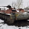 A destroyed Russian military vehicle is seen on the roadside on the outskirts of Kharkiv on February 26, 2022, following the Russian invasion of Ukraine. - Ukrainian forces repulsed a Russian attack on Kyiv but "sabotage groups" infiltrated the capital, officials said on February 26, as Ukraine reported 198 civilian deaths, including children, following Russia's invasion. A defiant Ukrainian President Volodymyr Zelensky vowed his pro-Western country would never give in to the Kremlin even as Russia said it had fired cruise missiles at military targets. (Photo by Sergey BOBOK / AFP)